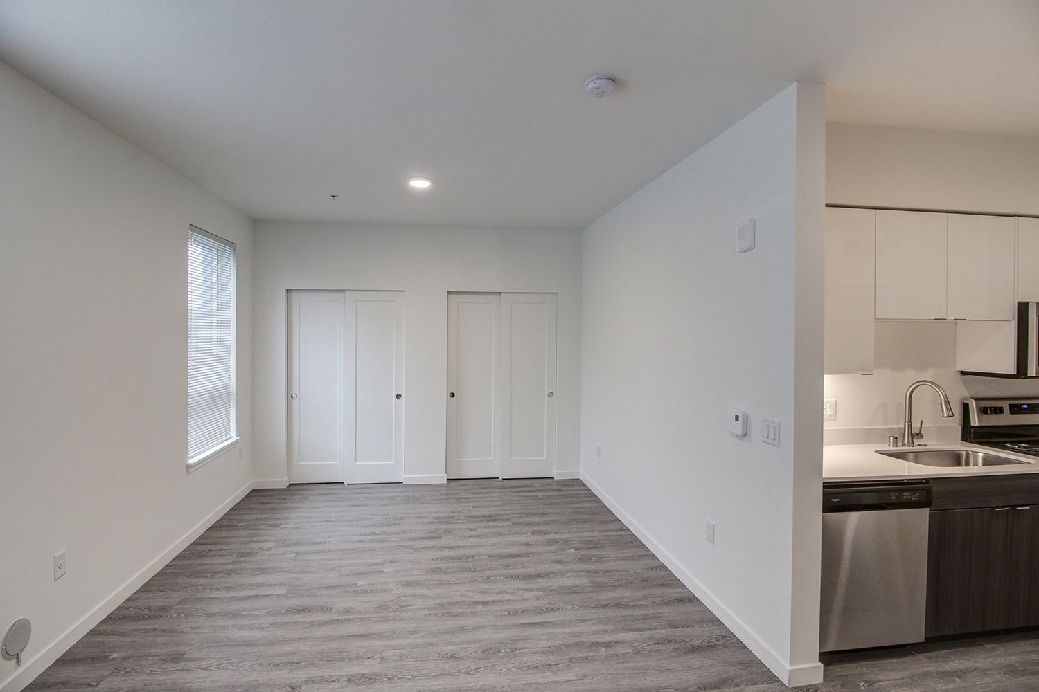Bedroom space in a studio apartment at The Woods at Alderwood in Lynnwood, WA.