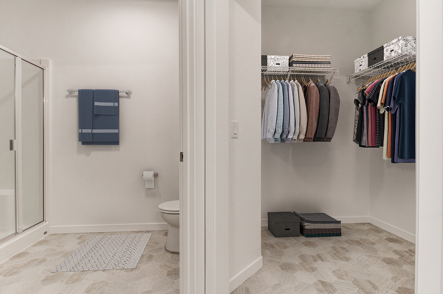 Spacious walk-in closet connected to a bathroom in an apartment at The Woods at Alderwood in Lynnwood, WA.
