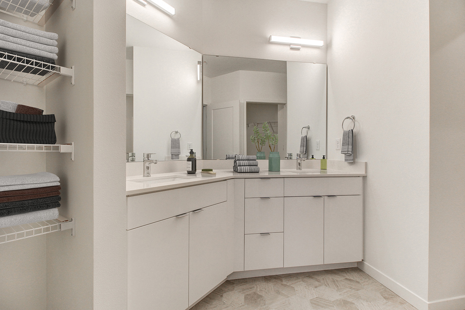 apartment bathroom with large vanity mirror at The Woods at Alderwood in Lynwood, WA